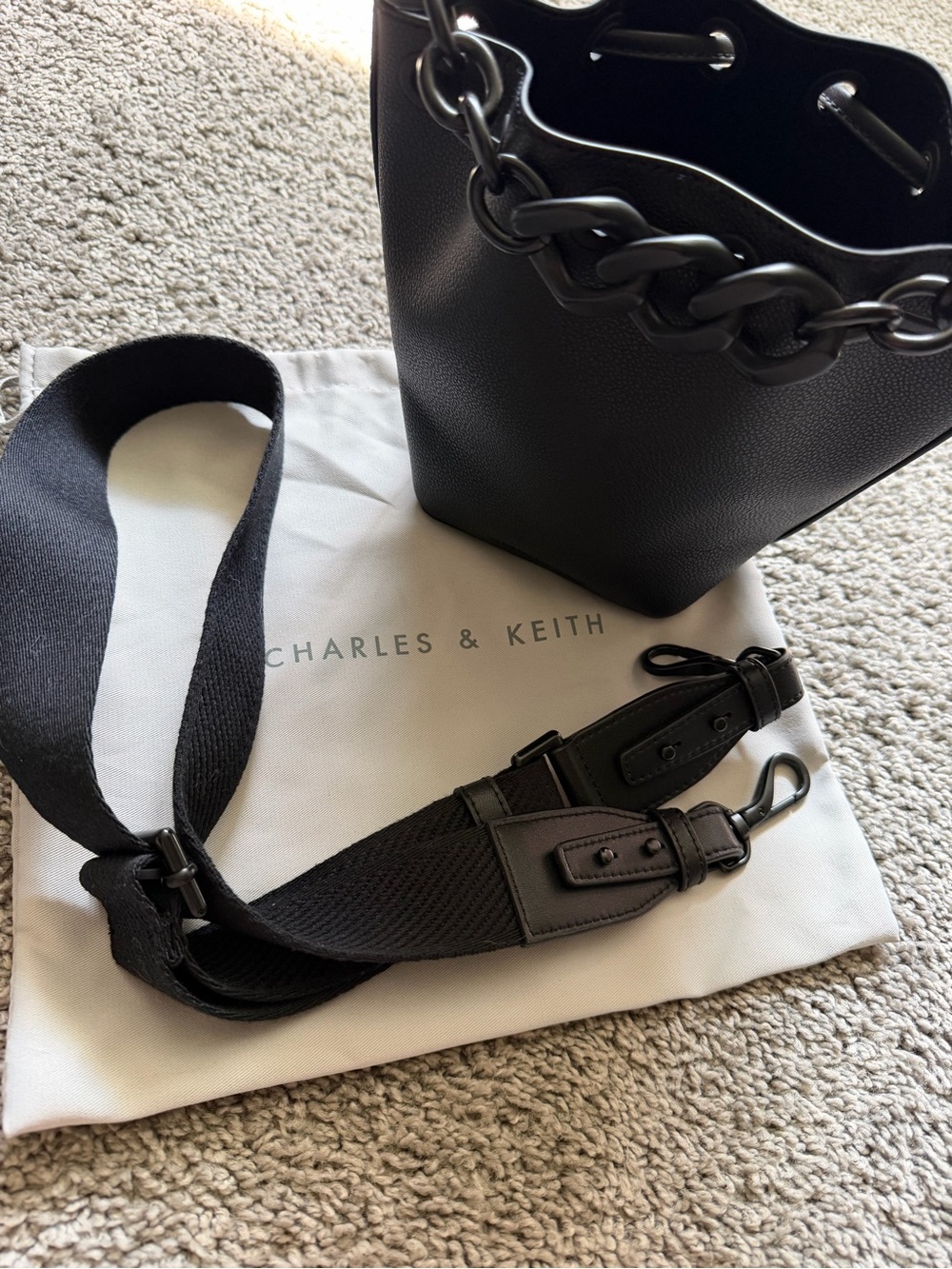 Charles & Keith Black Leather Bucket Bag with Chain Handle and Adjustable Strap